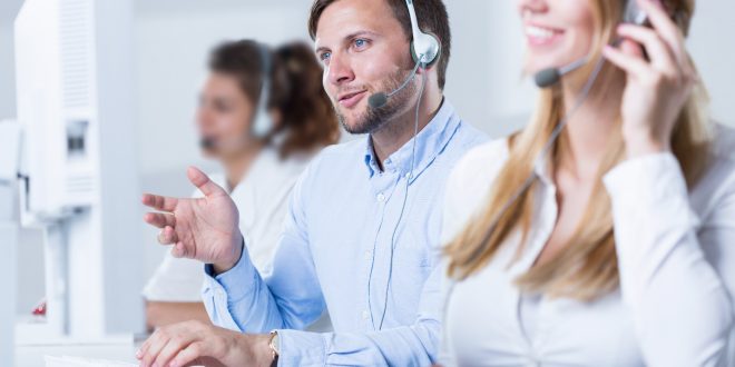 young call center team talking with customers